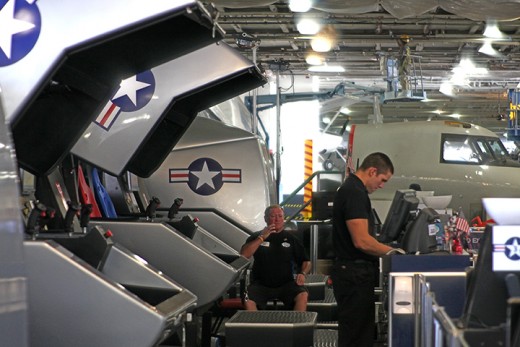 Guest operate their own flight simulator ride on board the USS Midway Museum