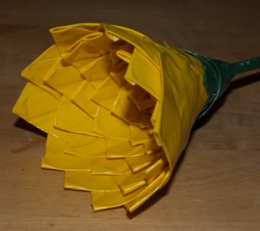 Detail of the green tape covering the bottom of the yellow taped area.