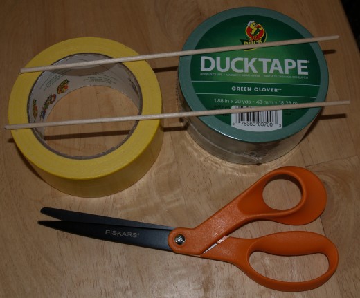Duck® Tape, wooden dowels, and scissors with non-stick blades.