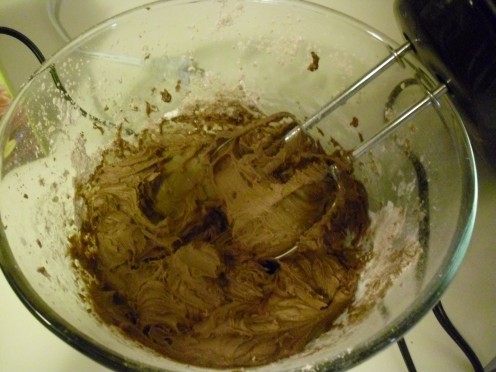 Mix the chocolate buttercream frosting until desired consistency.