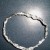 Twist ends together to form a circle. Twist ends together to form a circle.