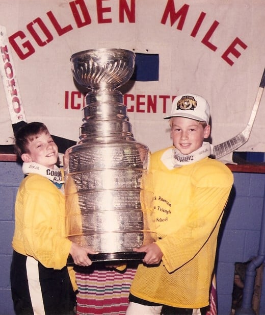 Brian (left) and his older brother Jeff hoist the Stanley Cup