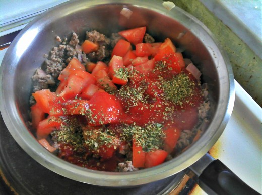 Herbs and tomatoes added