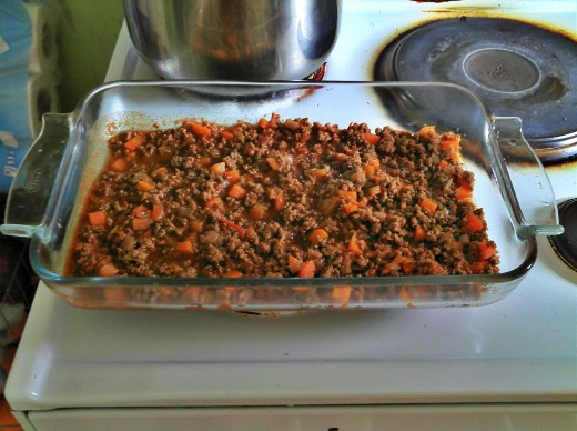 Minced meat sauce in baking dish.
