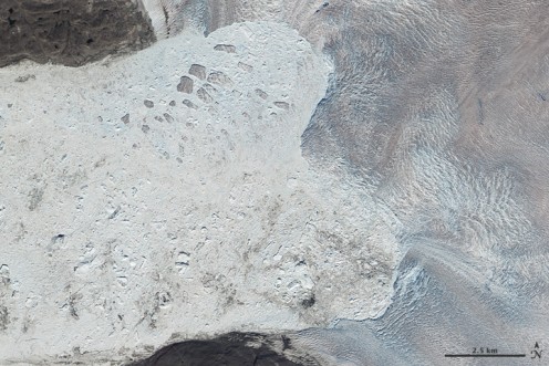 A 1-mile chunk collapses in July 2010. Glaciers are always calving into the sea; "melting" happens when they're breaking off and disappearing faster than snowfall is replenishing them.