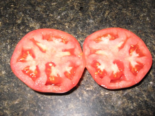 Slice the tomato in half.