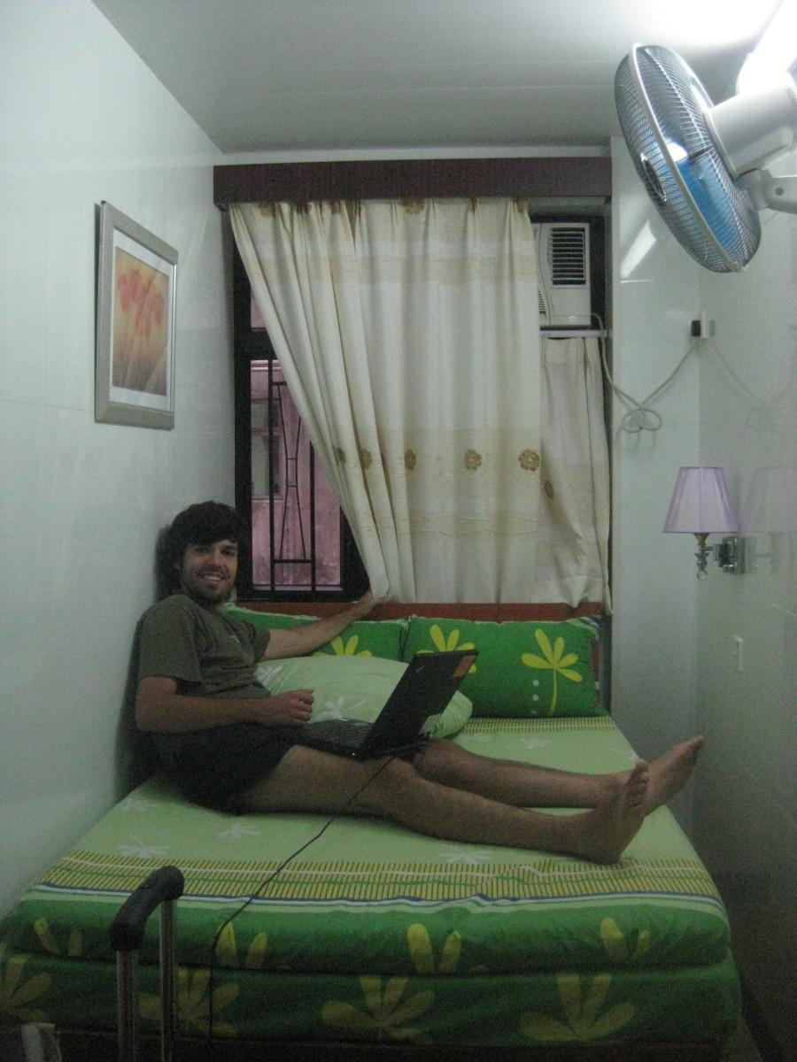 This was our tiny "double" hostel room at the Chungking Mansion. We literally had to jump on the bed to get on it! The windows went out to another building and the bathroom/shower just had standing room!