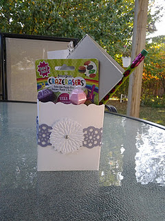 favor bag stuffed full of make and take craft items, mini drawing book and more