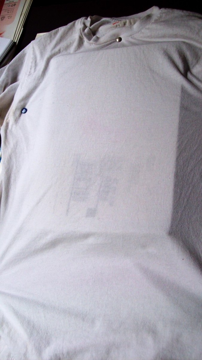 Be sure to insert a piece of cardboard between the front and back of the shirt so the markers don't bleed through to the back.