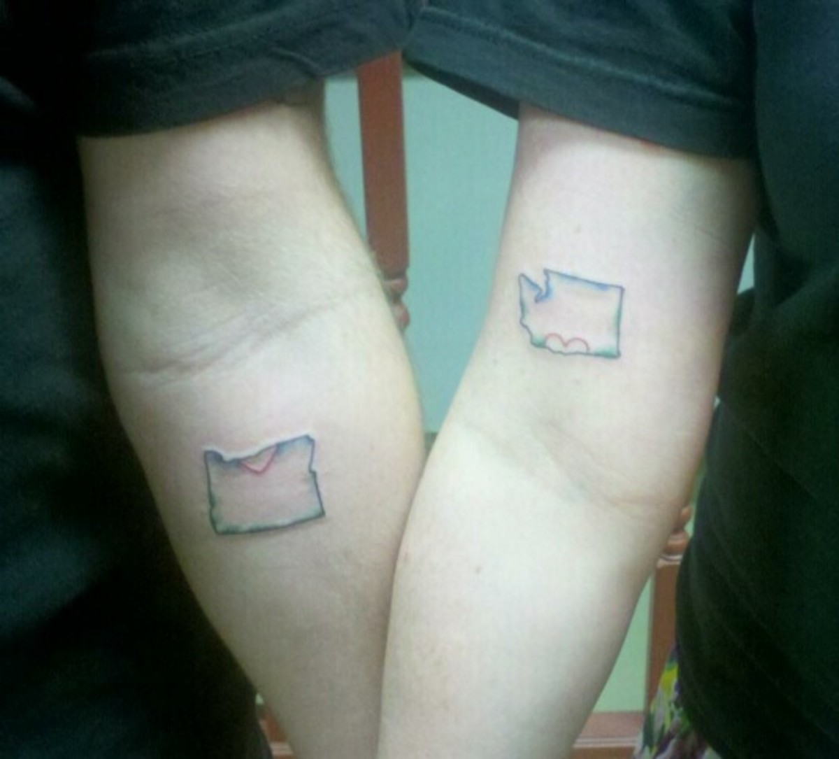 my wife and I got matching tattoos. i got the state of Oregon, with half a heart and she got the state of Washington, with the other half. The locations line up perfectly