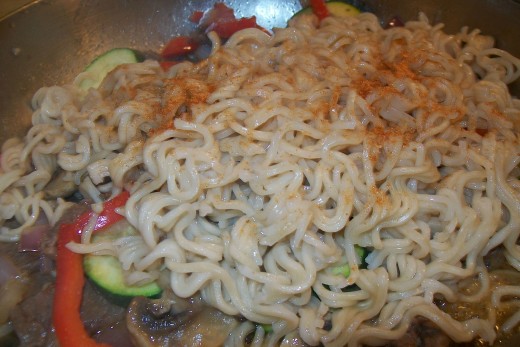 Add the cooked noodles and remaining seasoning