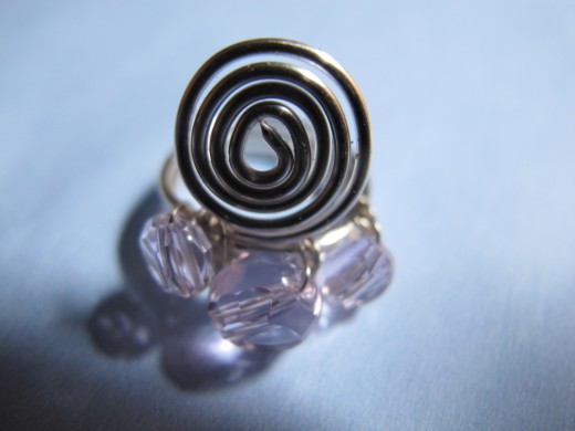 Spiral ring with pink crystals