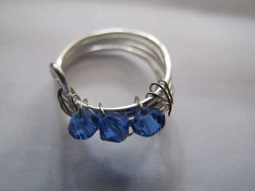 Coil ring with blue Swarovski crystals