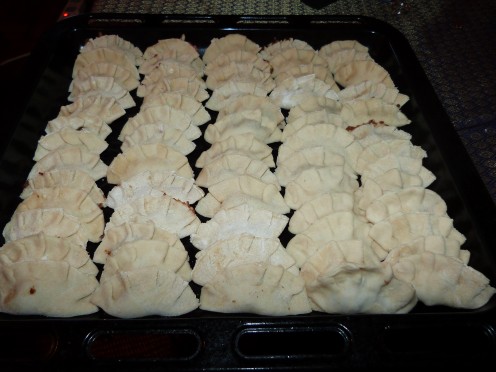 A tray of jiao zi or Chinese dumplings ready for cooking or to be packed for freezing