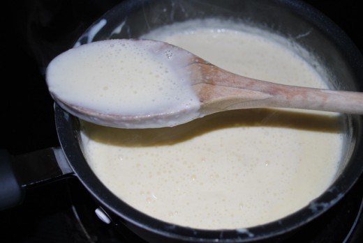Re-heat the cream and egg, stirring continuously.  When it begins to thicken, remove from the heat.