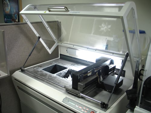 An example of a old style 3D printer. This is a much larger one although there are 3D printers available the size of a normal printer (look below at other pictures). 