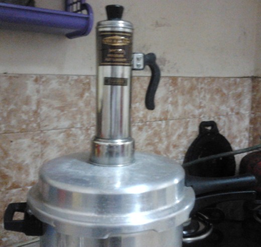 Fill puttu maker, with puttu powder and coconut scrappings, alternatively; when the steam comes, place the Puttu maker on the steam portion and cook for 5 minutes