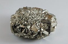 An egg-size cluster of Iron Pyrite crystals.  Magnified to show the astounding facets 