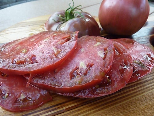 This is a carbon tomato, about half a pound with rich earthy tomao flavor.