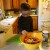Adding the onion rings to the tomato sauce mixture. Adding the onion rings to the tomato sauce mixture.