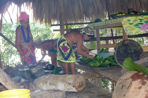 Embera women, partly topless, preparing lunch for us in the village cooking hut.
