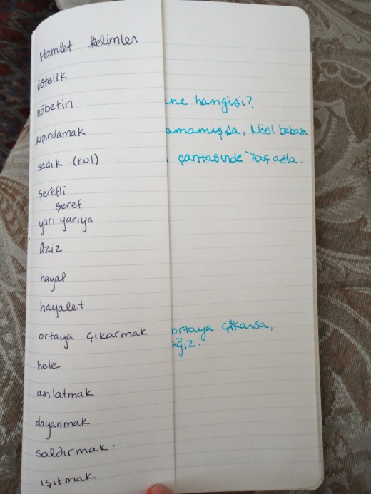 On the left, on a folded page, are the Turkish words. The English translation is folded under.