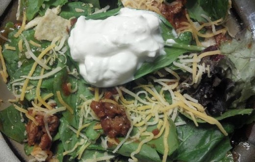 The sour cream is probably the unhealthiest part of this salad.  If you can go without it, the nutritional value rises.  It does, however, make a beautiful garnish on a tasty salad.