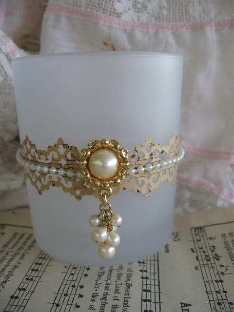  Earring, string of pearls and paper lace