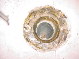 Removed Toilet Uncleaned Showing before cleaning the old Wax Ring