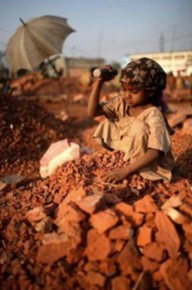young girl working in brick factory