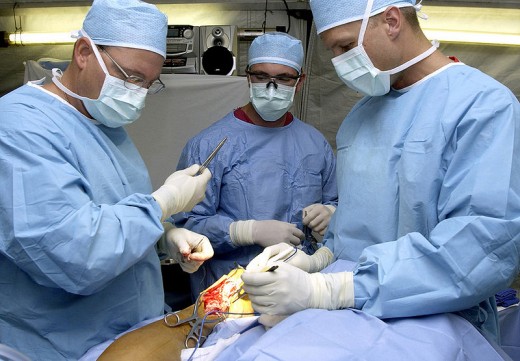 Surgeons carrying out operation.