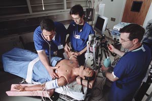 Anesthesia trainees learning on a simulated patient. These simulations are often used to teach emergency intervention in life-threatening situations. (creative commons license).