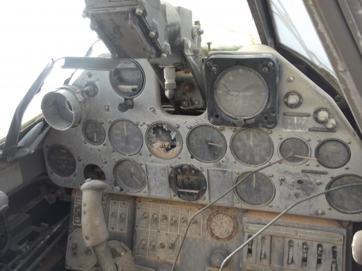 The instrument panel is remarkably intact after since the pilot's disappearance in 1942.  Black box at top of panel is the electrical gunsight used by the pilot to aim machine-gun fire and bombs at targets.