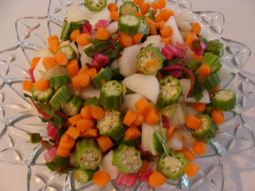 Chop vegetables and place in a bowl for the kids to put into the pot.