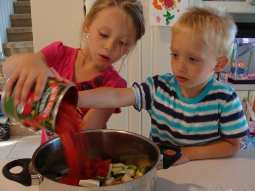 Adding the diced tomatoes.