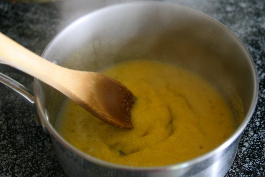 Cook cornmeal with 1/2 cup water until the mixture thickens.