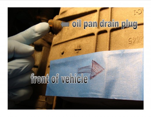 Identifying the oil pan drain plug.