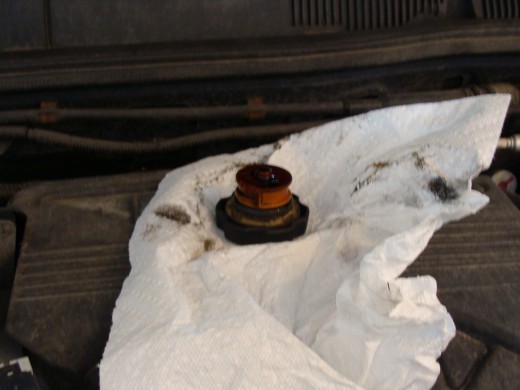 Place the oil cap on top of the cover so that it is easy to find.