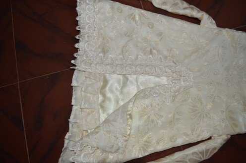 The bottom portion with the frills in the satin lining