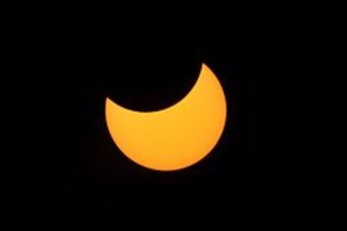The crescent shape of a partial solar eclipse is caused when the moon enters the path between the earth and sun.
