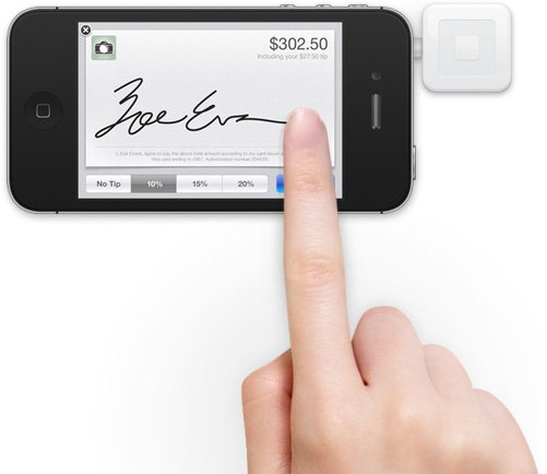 Signing for the credit card transaction.