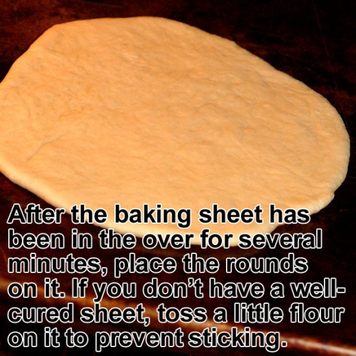 Place a baking sheet on the middle rack of the oven until it is hot. Then place the flat pita round on the screaming-hot sheet. 