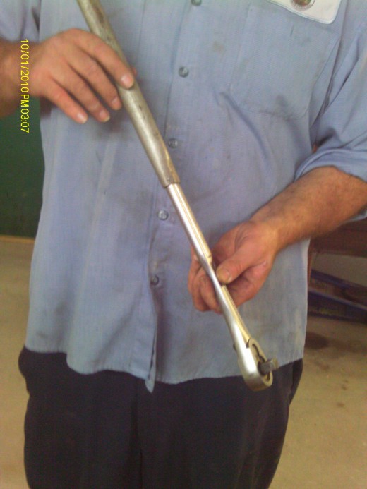An example of a makeshift long handled ratchet using a breaker bar, or 'cheater's bar'.