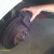 Remove the caliper to get to the brake pads, and inspect for damage.  Replace as necessary.