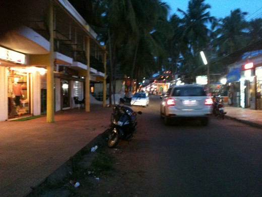 Vehicles moving at a market near Candolim beach in Goa.