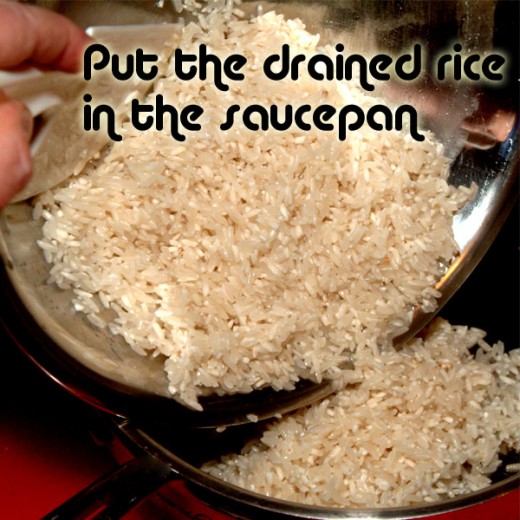 Put drained rice in the saucepan.