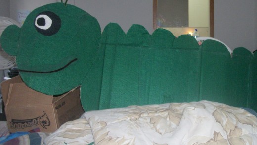 This is Charlie the Caterpillar he is made out of an old piece of cardboard box, glue and felt. 