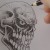 Tone within tone works well against the ink lines especially to simulate cracks on the skull.