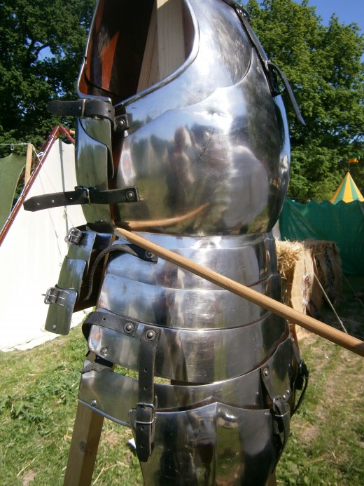 The second arrow deflected on the steel (we found the marks) and went in through the side. No wound.