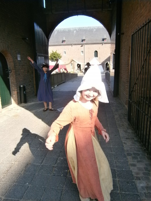 Children at play, gatehouse between fore-courtyard and main courtyard.